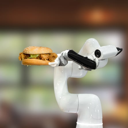 Un brazo robótico sosteniendo una hamburguesa